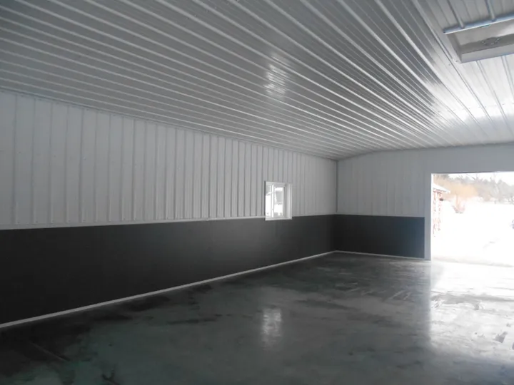 Interior liner-panel wainscot along a shop wall